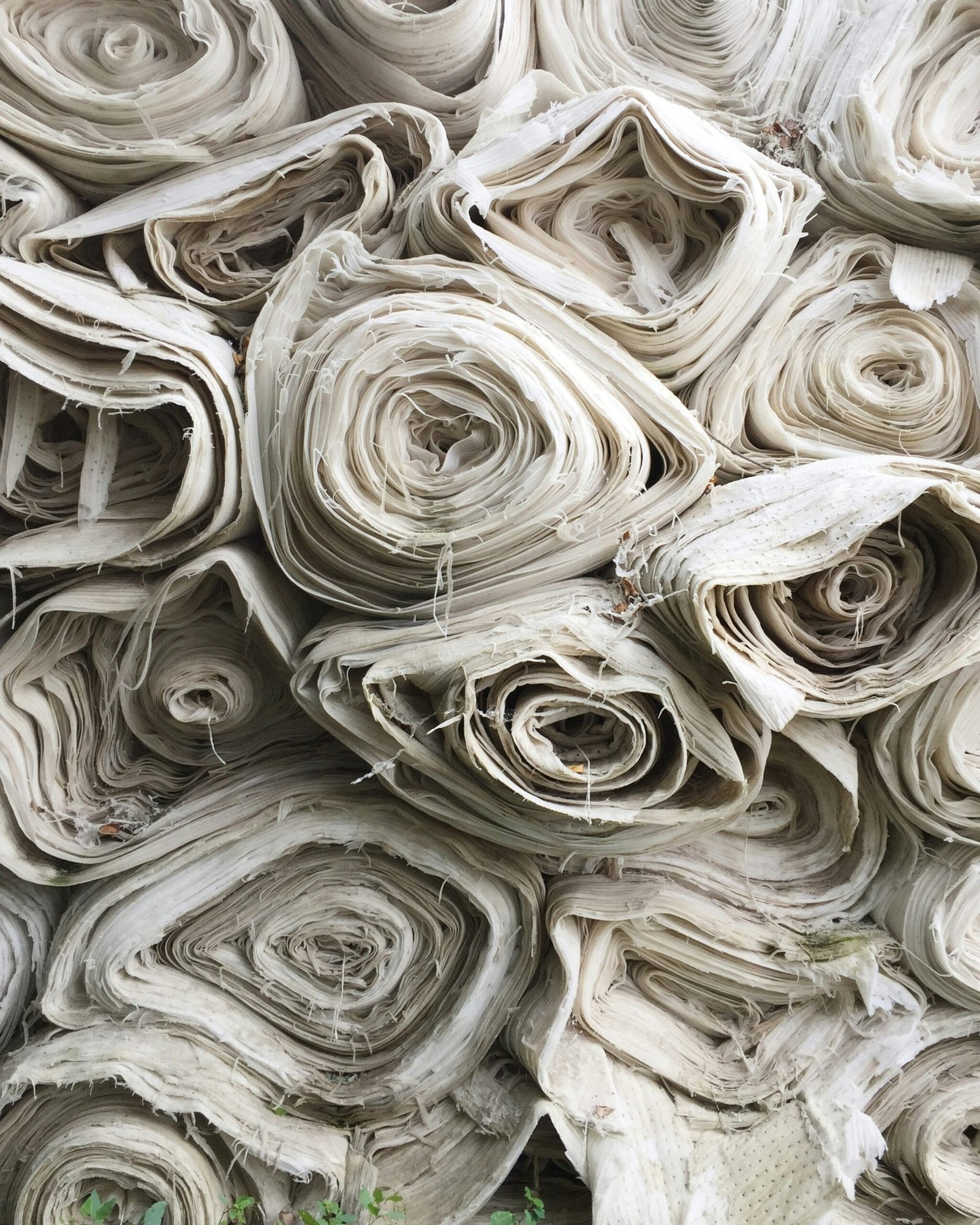 The Benefits of Using Recycled Materials in UK Garden Design white textile lot